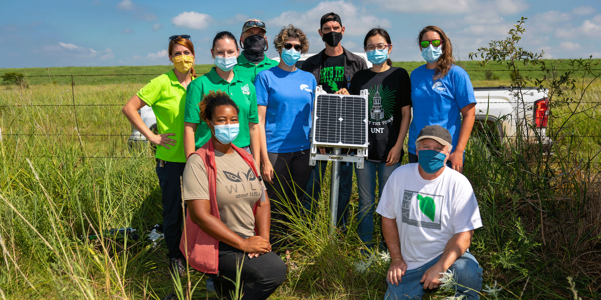 Lu Liang and researchers outside