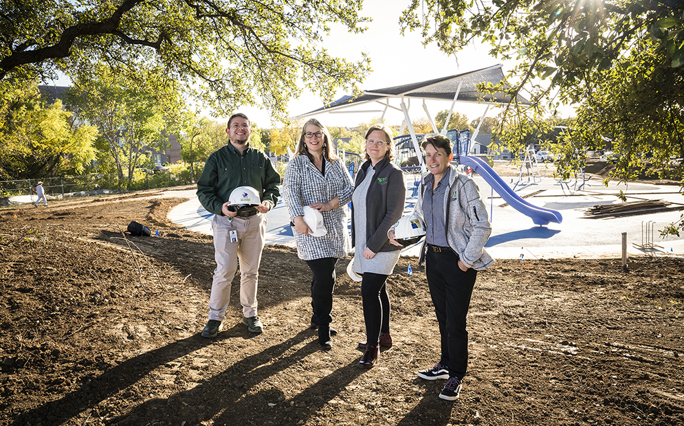 UNT researchers and representatives from the city of Lewisville stand in front of Parque la Gloria, or Glory Park.