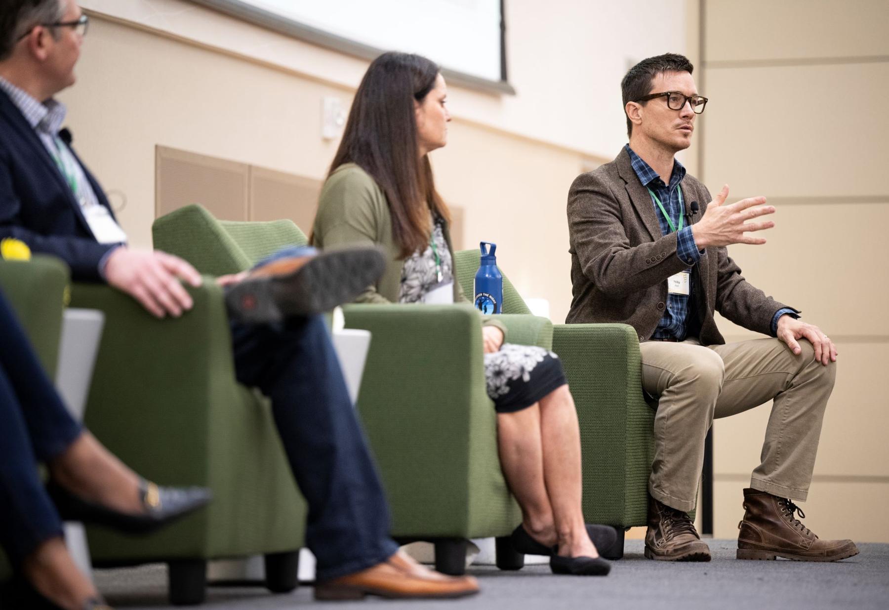 people sitting in chairs presenting