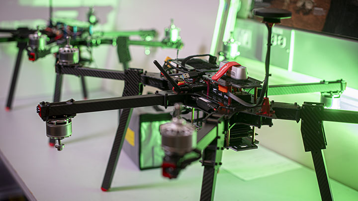 drones in facility with green light
