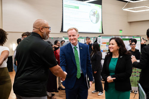 UNT President Harrison Keller and Vice President of Research and Innovation Pamela Padilla greet attendees at University Research Day