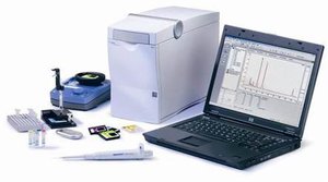 Photo of processor, a laptop, and several small pieces of equipment on a white background