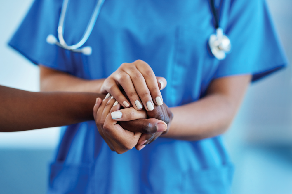 medical workers holding hands