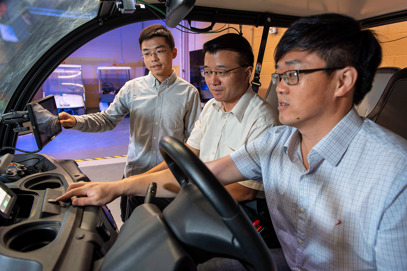 Photo of UNT researchers inside the autonomous car they built