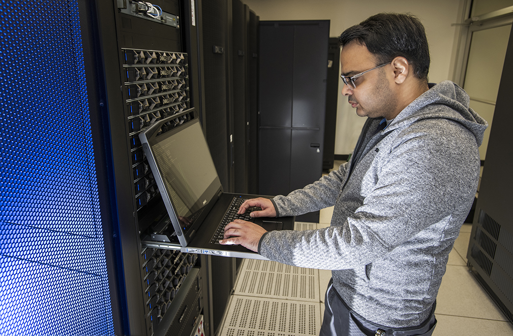 Photo of UNT employee working in high performing computing facility