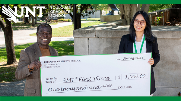 Joseph Oppong and Huyen Nguyen outside with large $1000 check - 3MT First Place