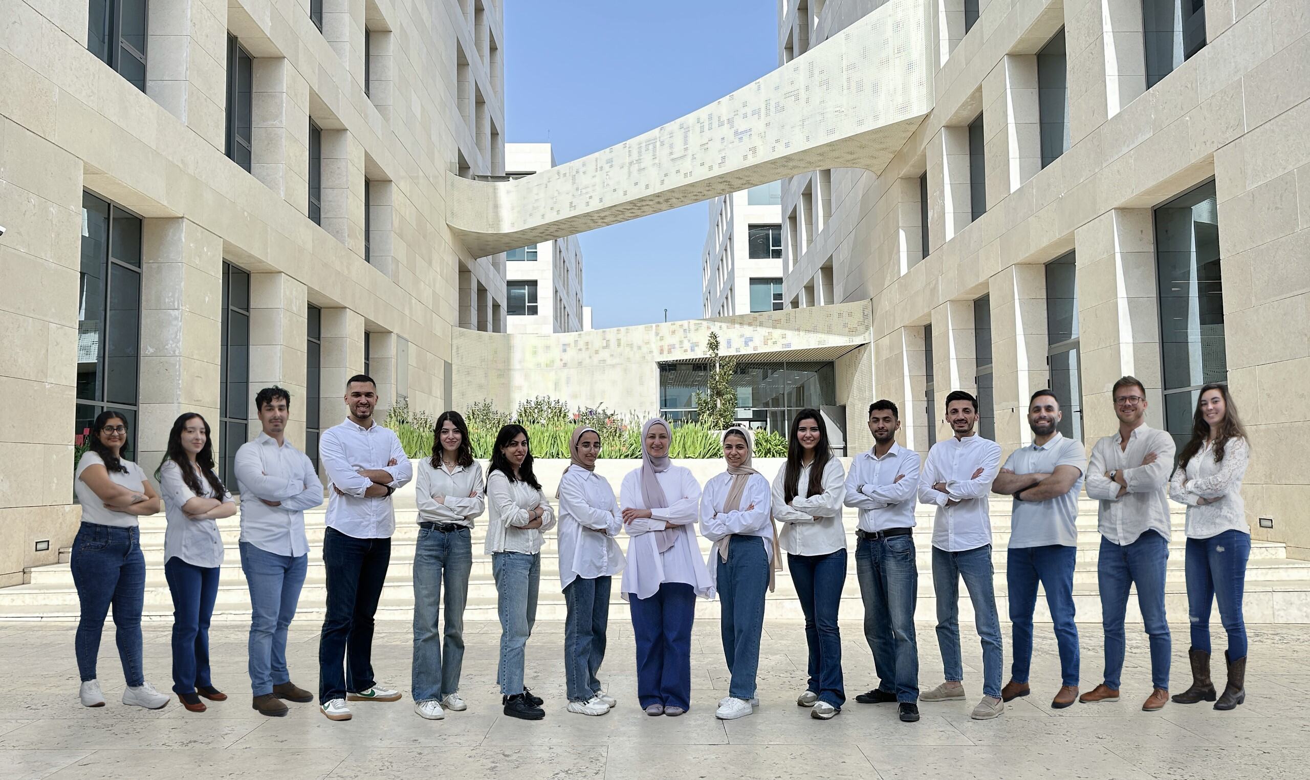 Photo of UNT engineering students with other students from Al Hussein Technical University