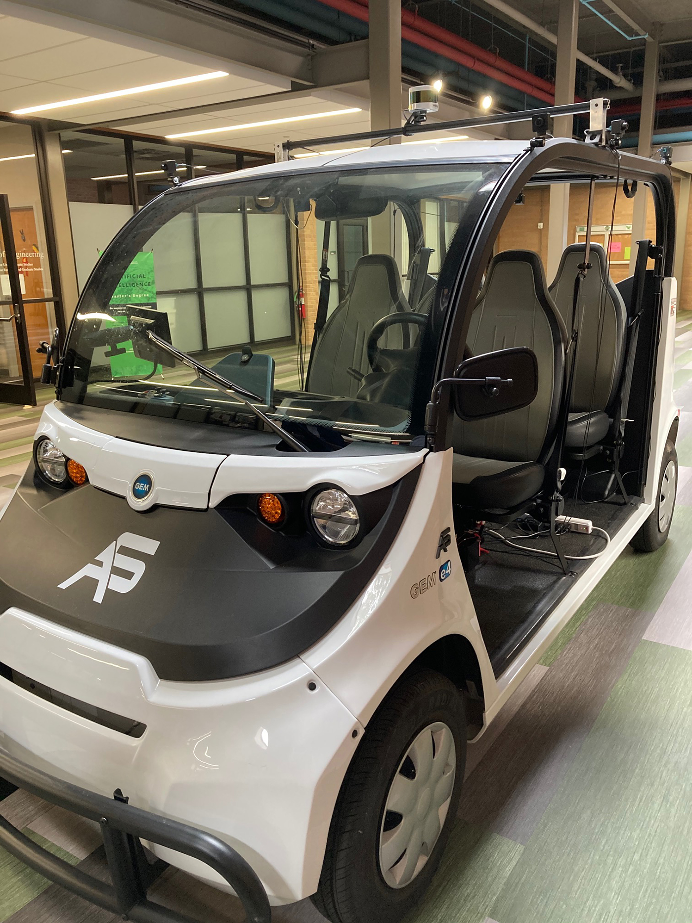 Front angle of autonomous vehicle in Research Park building